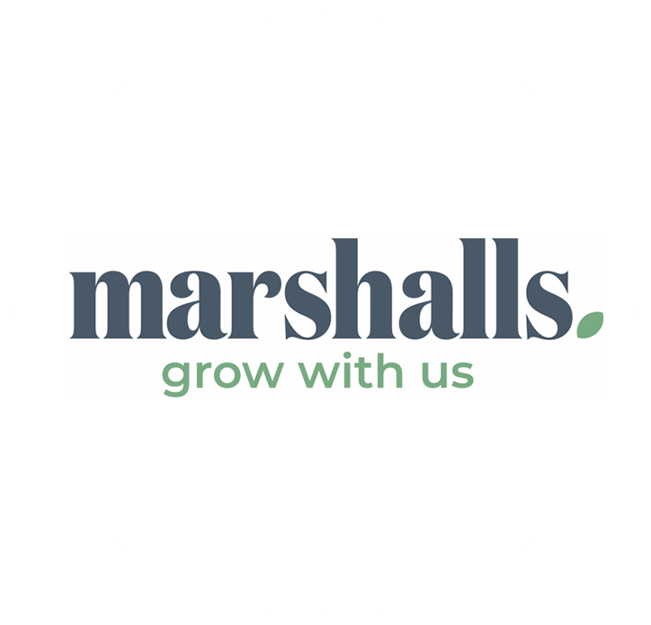 Marshalls logo with the text "marshalls" in dark blue and "grow with us" in green, featuring a small green leaf on a white background.